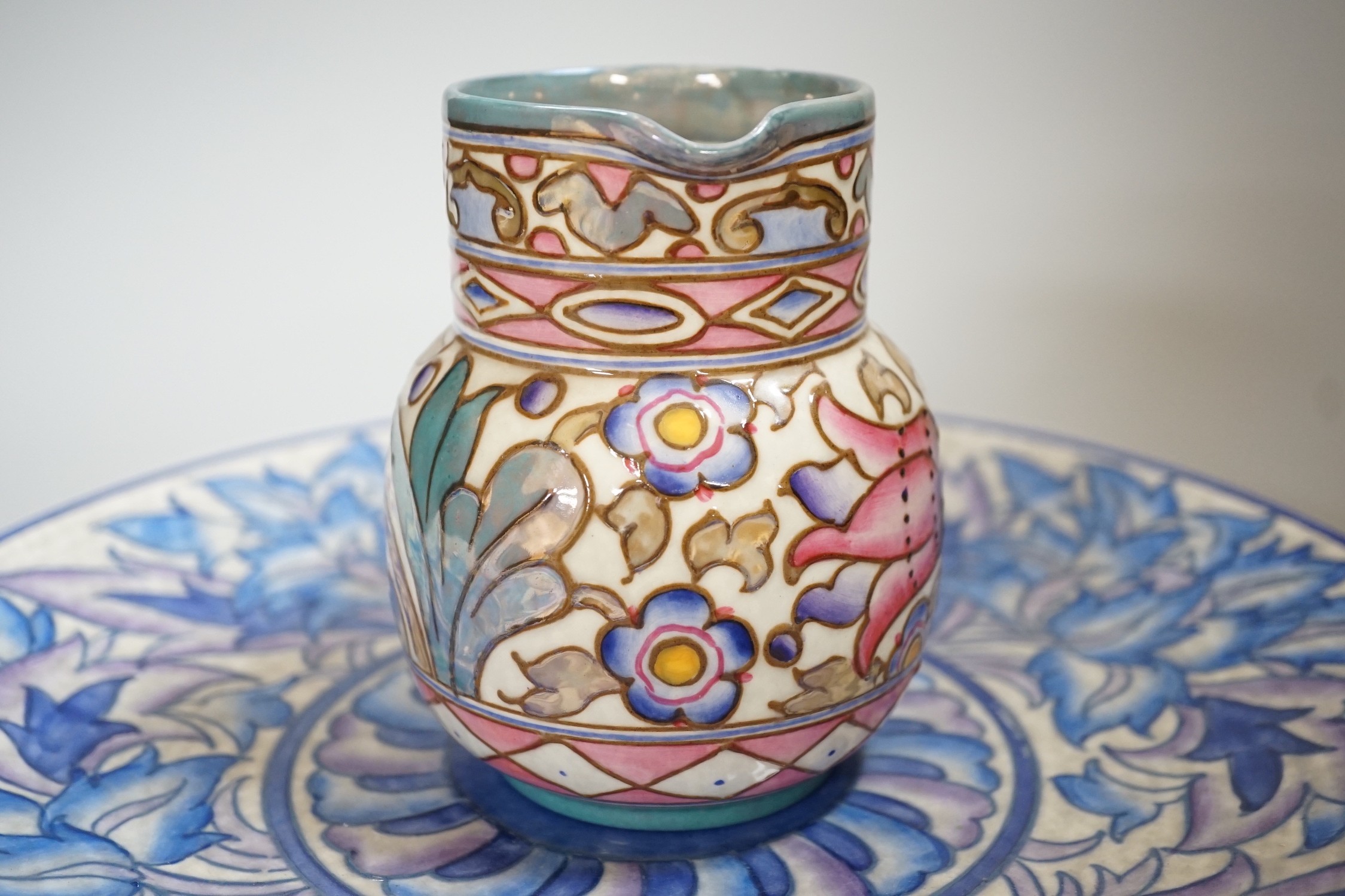 A Burleigh ware Charlotte Rhead lustre jug and a Crown Ducal dish, diameter 32cm
